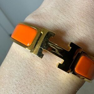*Scratched* Hermes Clic Clac Gold & Orange Bracelet